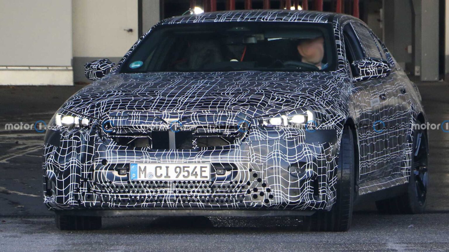 Spy footage captures 2024 BMW M5 interior with curved screen and flat