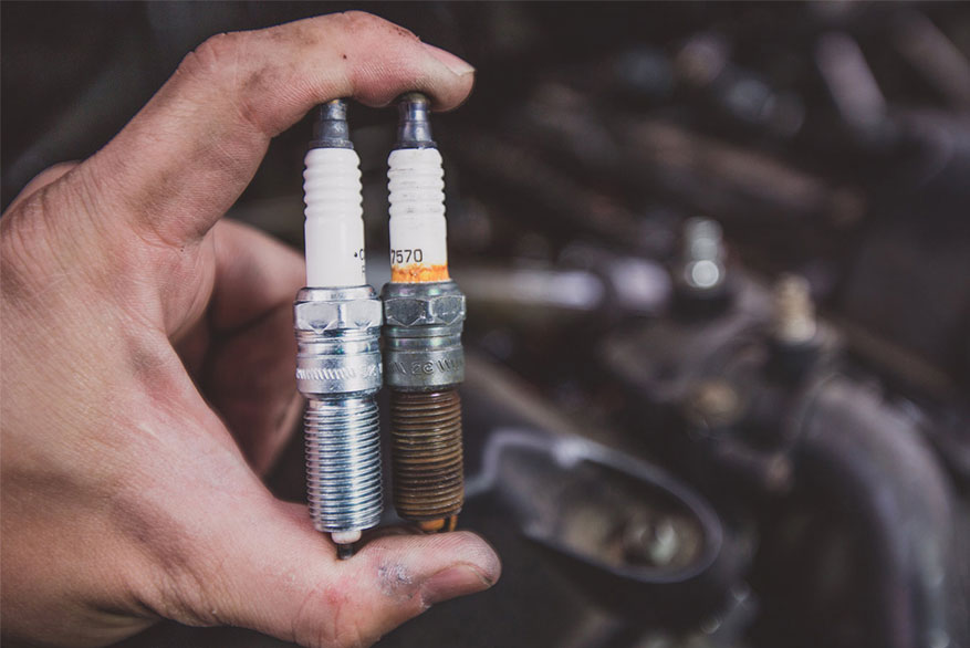 How do I know if my car needs a spark plug change?