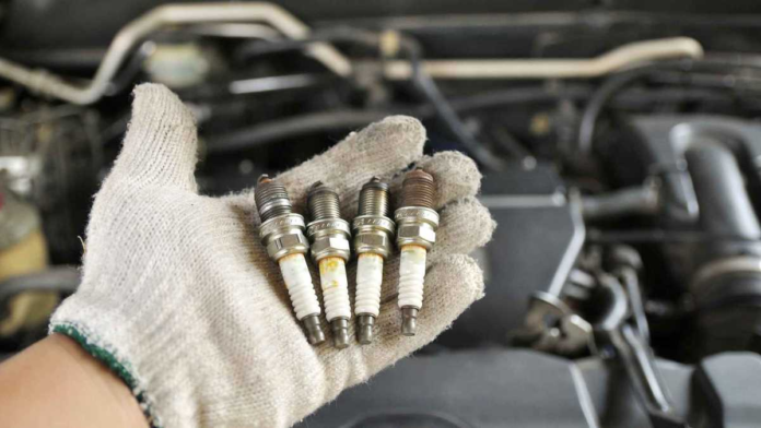 How do I know if my car needs a spark plug change?