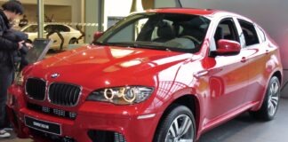 BMW X6 M E71 usado: inspección y mantenimiento antes de comprar BMW X6 M E71 rojo, vista frontal de tres cuartos